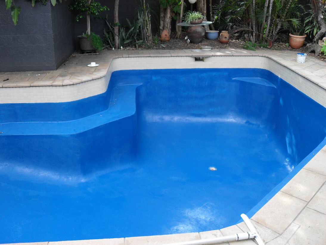 A pool interior resurfaced and painted a rich blue